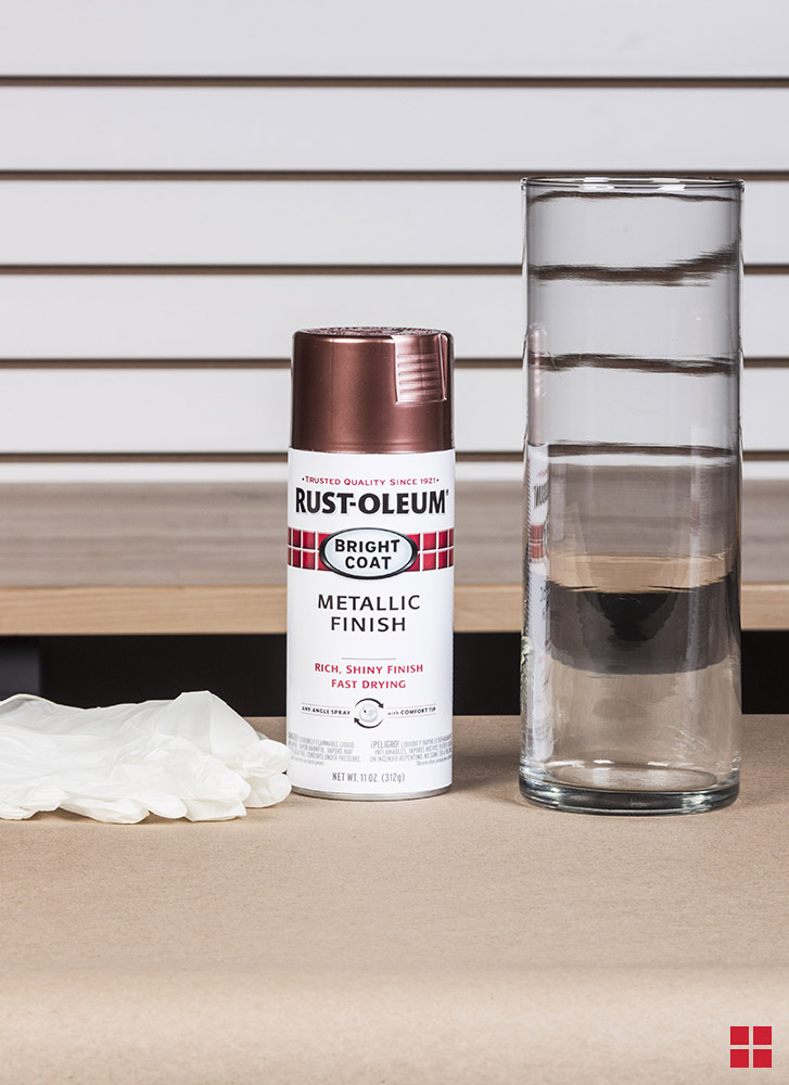 Plain glass vase next to a can of Rust-Oleum spray paint.