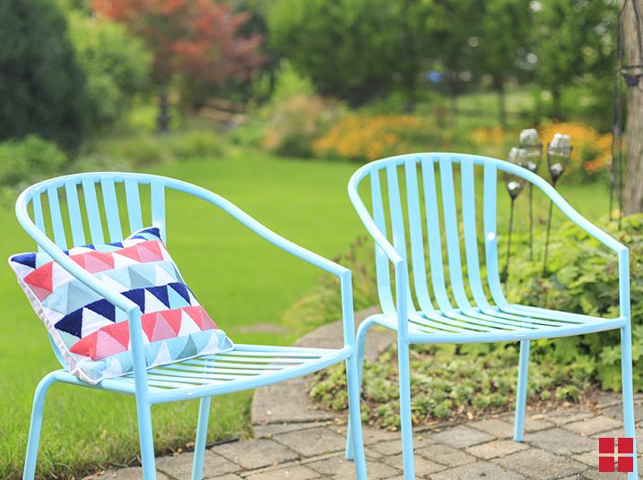 Two light blue patio chairs.