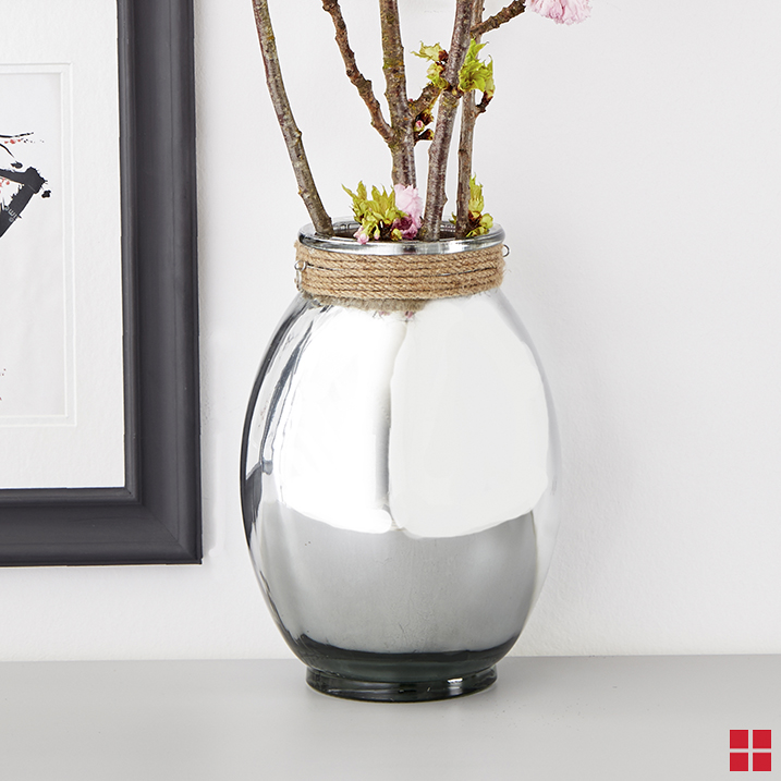 Flowers in a mirrored glass vase.