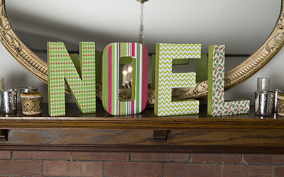 Decorated block letters that spell “Noel.”